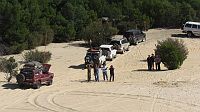 19-The rest of the convoy watch the next 4WD climb up the steep dune